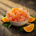 Santre Wali Toffee orange candy in a bowl with fresh oranges - nostalgic product photo