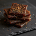 Black aam papad macro close-up professional product shot with spice coating